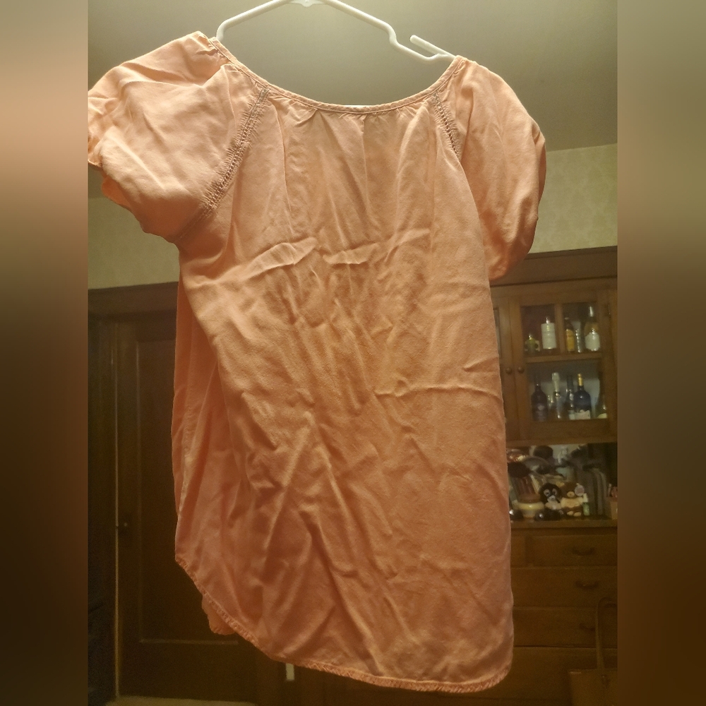 A medium peach blouse